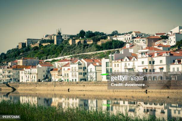 view of city alcacer do sal near the river sado in portugal - alcacer stock pictures, royalty-free photos & images