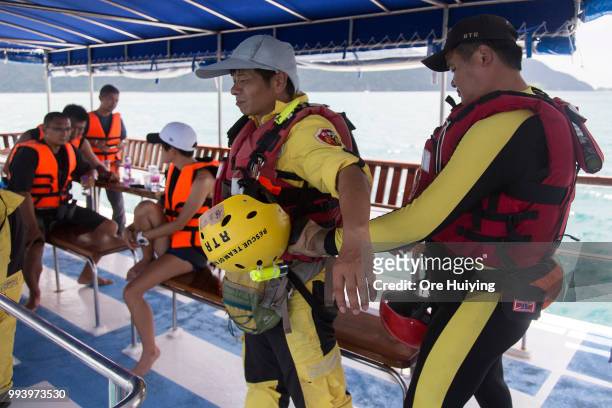 Team of volunteers made up of Chinese rescue experts and divers from a Thai diving center prepare for a search at sea on the fourth day of rescue...