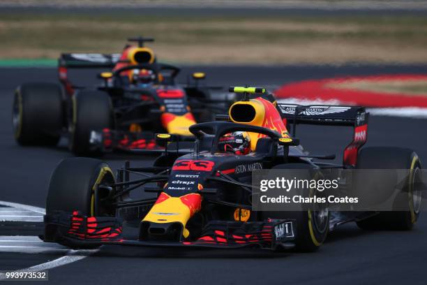 Max Verstappen of the Netherlands driving the Aston Martin Red Bull Racing RB14 TAG Heuer leads Daniel Ricciardo of Australia driving the Aston...