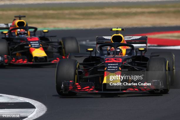 Max Verstappen of the Netherlands driving the Aston Martin Red Bull Racing RB14 TAG Heuer leads Daniel Ricciardo of Australia driving the Aston...