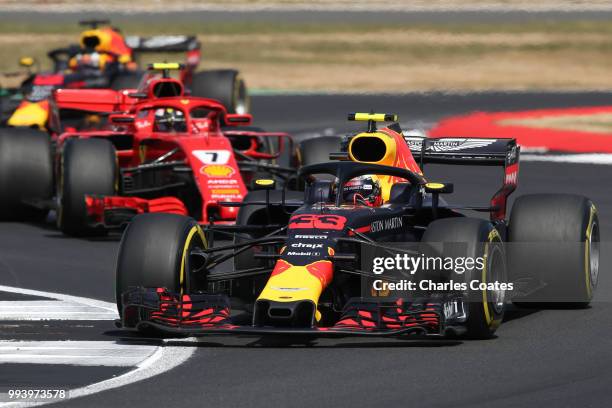 Max Verstappen of the Netherlands driving the Aston Martin Red Bull Racing RB14 TAG Heuer leads Kimi Raikkonen of Finland driving the Scuderia...