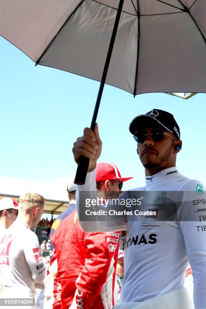 Lewis Hamilton of Great Britain and Mercedes GP prepares to drive on the grid before the Formula One Grand Prix of Great Britain at Silverstone on...