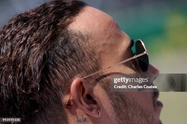 Lewis Hamilton of Great Britain and Mercedes GP prepares to drive on the grid before the Formula One Grand Prix of Great Britain at Silverstone on...