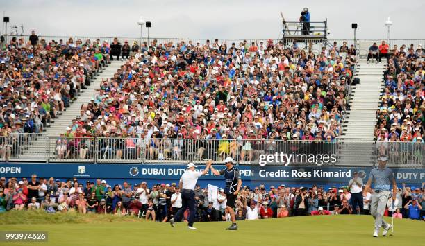 Russell Knox of Scotland celebrates his birdie on the 18th green during the final round of the Dubai Duty Free Irish Open at Ballyliffin Golf Club on...