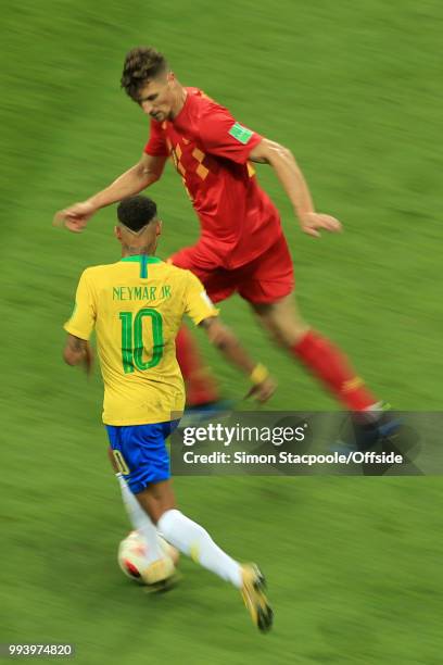 Neymar of Brazil runs at Thomas Meunier of Belgium during the 2018 FIFA World Cup Russia Quarter Final match between Brazil and Belgium at Kazan...