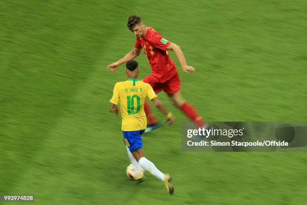 Neymar of Brazil runs at Thomas Meunier of Belgium during the 2018 FIFA World Cup Russia Quarter Final match between Brazil and Belgium at Kazan...