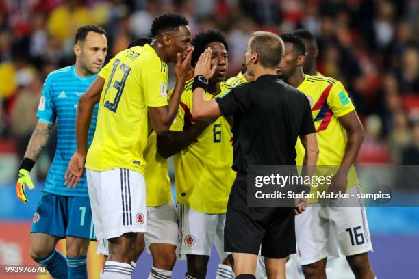 Yerry Mina of Colombia Carlos Sanchez of Colombia Referee Mark Geiger USA during the 2018 FIFA World Cup Russia Round of 16 match between Colombia...