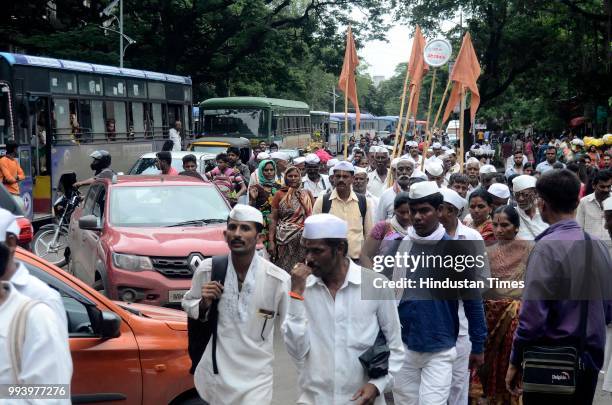 Traffic were stopped by Pune Police on JM road as Pilgrims arrive carrying palki of Saint Dnyaneshwar for annual pilgrimage from Alandi towards...