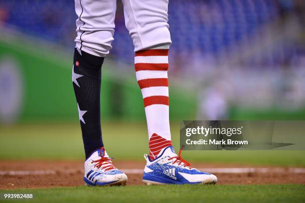 Detailed view of the Stars and Stripes edition Adidas cleats and Stance socks worn by Lewis Brinson of the Miami Marlins during the game against the...