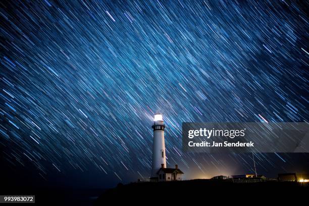 long exposure of night sky at pigeon point lighthouse. - pescadero stock pictures, royalty-free photos & images