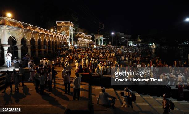 Devotees also known as warkaris on Alandi Ghat bank of Indrayani river where Gyaneshwar took his Samadhi during annual pilgrimage called the Wari...