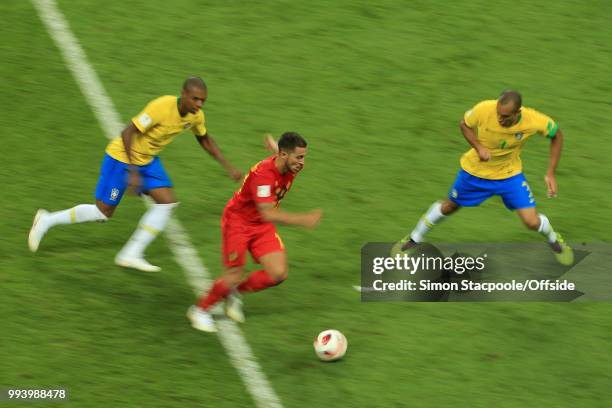 Eden Hazard of Belgium battles with Fernandinho of Brazil and Miranda of Brazil during the 2018 FIFA World Cup Russia Quarter Final match between...