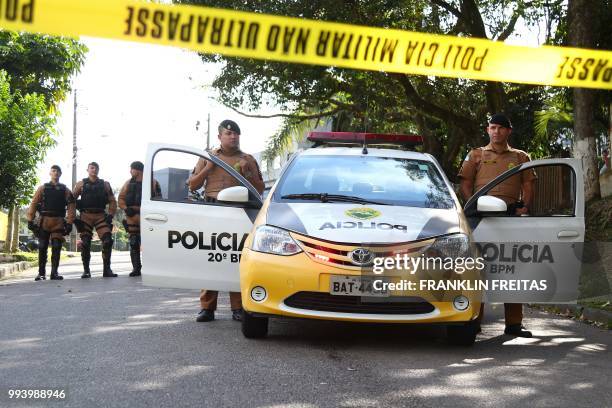 Curitiba´s police officers block the street that leads to the Federal Police Headquarters in Curitiba, Parana State, Brazil on July 8, 2018. - A...