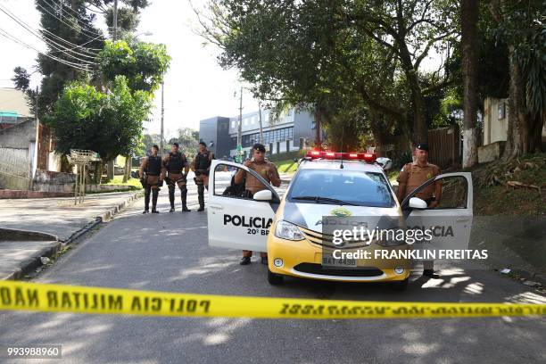 Curitiba´s police officers block the street that leads to the Federal Police Headquarters in Curitiba, Parana State, Brazil on July 8, 2018. - A...