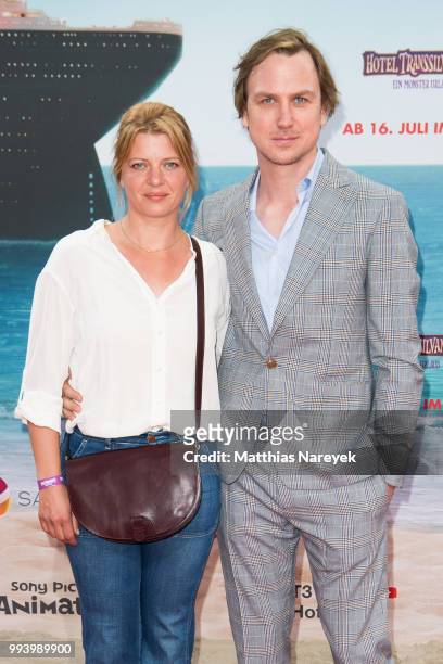 Joerdis Triebel and Lars Eidinger attend the 'Hotel Transsilvanien 3' premiere at CineStar on July 8, 2018 in Berlin, Germany.