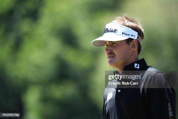 John Peterson walks to his second shot on the 18th hole during the final round of A Military Tribute At The Greenbrier held at the Old White TPC...