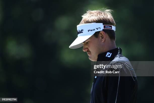 John Peterson walks to his second shot on the 18th hole during the final round of A Military Tribute At The Greenbrier held at the Old White TPC...