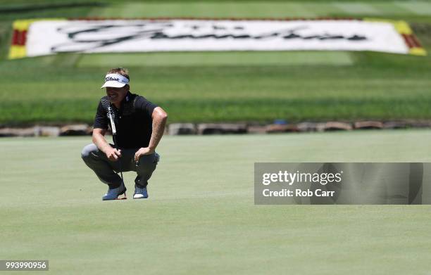 John Peterson waits to putt on the 18th hole during the final round of A Military Tribute At The Greenbrier held at the Old White TPC course on July...