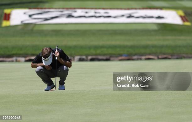 John Peterson waits to putt on the 18th hole during the final round of A Military Tribute At The Greenbrier held at the Old White TPC course on July...