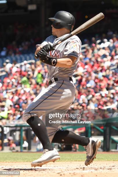 Realmuto of the Miami Marlins singles in two runs in the second inning during a baseball game against the Washington Nationals at Nationals Park on...