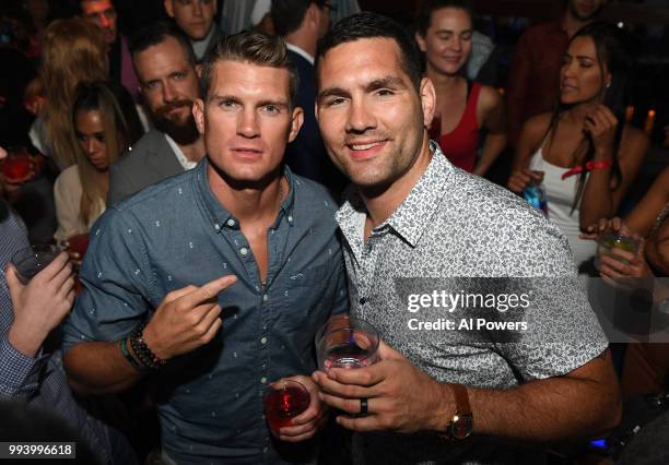 Fighters Stephen Thompson and Chris Weidman pose for a photo during the UFC 226 afterparty at Hakkasan Las Vegas Restaurant and Nightclub at MGM...