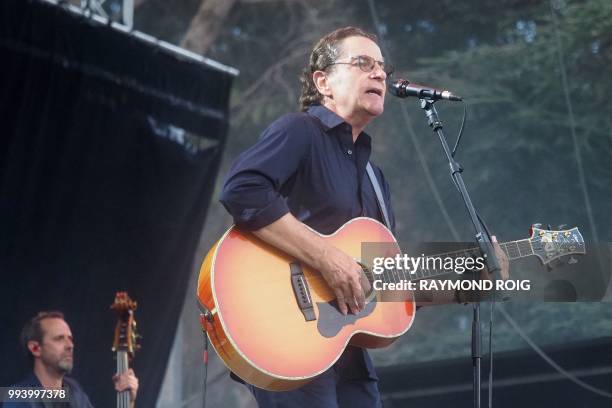 French singer Francis Cabrel performs on the stage of Les Deferlantes festival in Argeles-sur-Mer, southern France, on July 8, 2018.