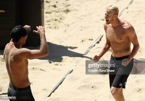 Sean Rosenthal and Chase Budinger celebrate winning their semifinal match against Tim Bomgren and Chaim Schalk at the AVP San Francisco Open at Pier...