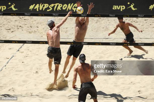Sean Rosenthal and Chase Budinger play in the far court against Tim Bomgren and Chaim Schalk in the semifinals at the AVP San Francisco Open at Pier...