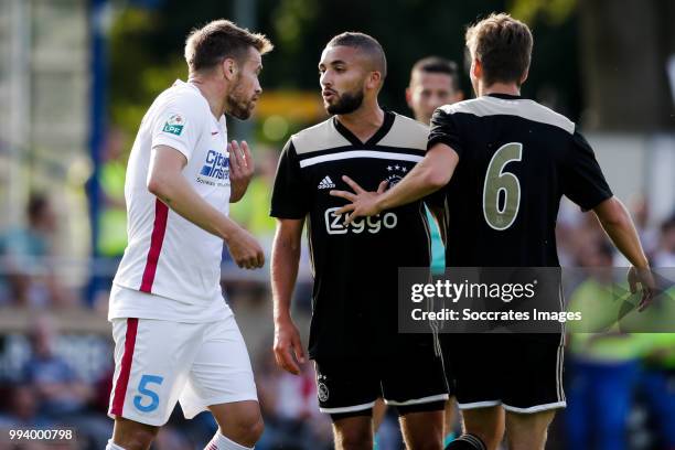 Mihai Pintilii of Steaua Bucharest, Zakaria Labyad of Ajax during the Club Friendly match between Ajax v Steaua Bucharest at the Sportpark 't...