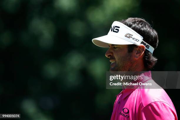 Bubba Watson reacts after hitting his second shot on the first hole during the final round of A Military Tribute At The Greenbrier held at the Old...