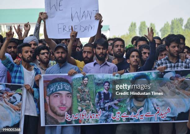 People shout slogans during a protest inside the Kashmir University campus on July 8, 2018 in Srinagar, India. Normal life was disrupted in Kashmir...