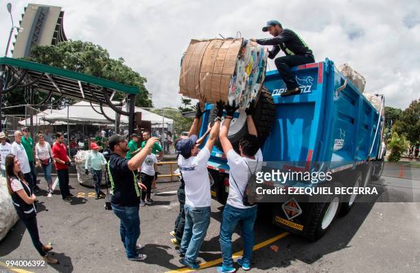 People help to collect 25 tons of plastic bottles for recycling, in eight hours, in order to set a Guinness World Record, in San Jose on July 8, 2018.