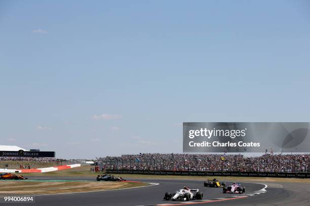 Charles Leclerc of Monaco driving the Alfa Romeo Sauber F1 Team C37 Ferrari leads Esteban Ocon of France driving the Sahara Force India F1 Team VJM11...