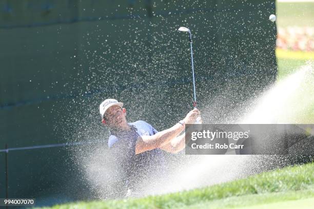 Scott Stallings hits out of the bunker on the 18th hole during the final round of A Military Tribute At The Greenbrier held at the Old White TPC...