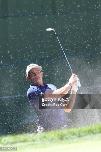 Scott Stallings hits out of the bunker on the 18th hole during the final round of A Military Tribute At The Greenbrier held at the Old White TPC...