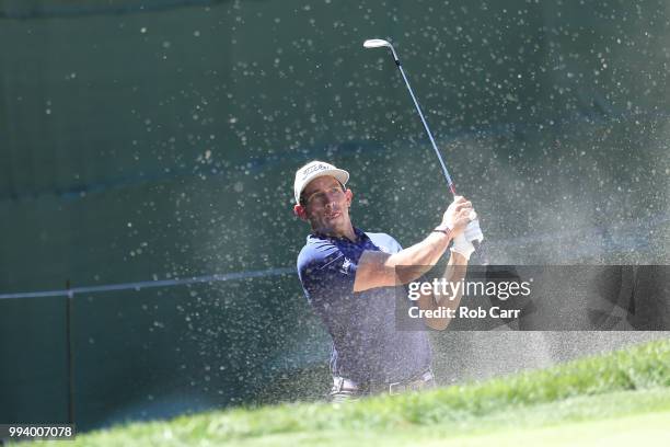 Scott Stallings hits out of the bunker on the 18th hole during the final round of A Military Tribute At The Greenbrier held at the Old White TPC...