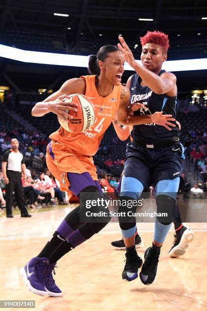 DeWanna Bonner of the Phoenix Mercury drives to the basket against Angel McCoughtry of the Atlanta Dream on July 8, 2018 at McCamish Pavilion in...