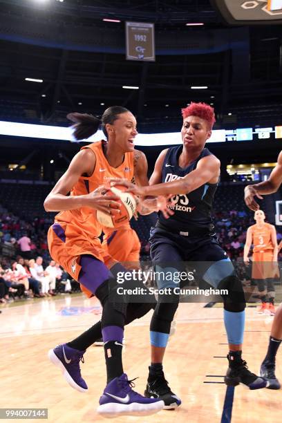 DeWanna Bonner of the Phoenix Mercury drives to the basket against Angel McCoughtry of the Atlanta Dream on July 8, 2018 at McCamish Pavilion in...