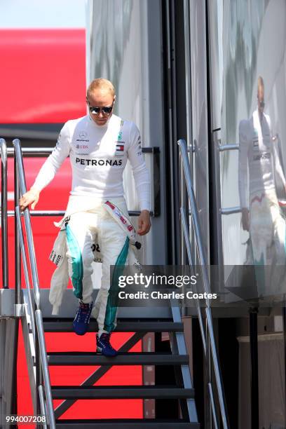 Valtteri Bottas of Finland and Mercedes GP walks in the Paddock before the Formula One Grand Prix of Great Britain at Silverstone on July 8, 2018 in...