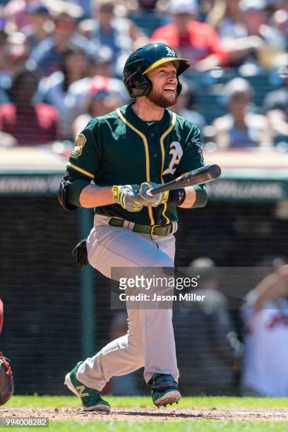 Jed Lowrie of the Oakland Athletics hits a solo home run during the seventh inning against the Cleveland Indians at Progressive Field on July 8, 2018...