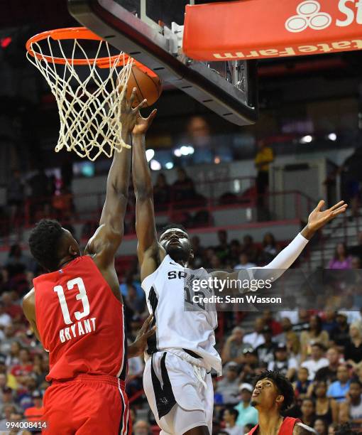 Chimezie Metu of the San Antonio Spurs shoots a layup against Thomas Bryant of the Washington Wizards during the 2018 NBA Summer League at the Thomas...