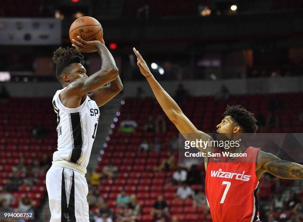 Lonnie Walker IV of the San Antonio Spurs shoots against Devin Robinson of the Washington Wizards during the 2018 NBA Summer League at the Thomas &...