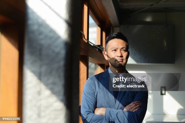 serious-looking businessman - male portrait suit and tie 40 year old stock pictures, royalty-free photos & images