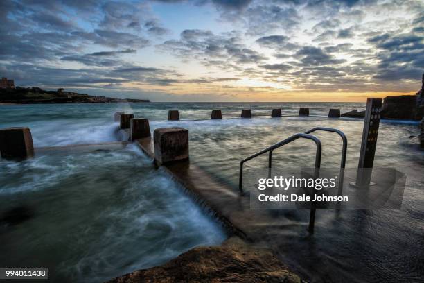 coogee beach sunrise, sydney australia - coogee beach stock pictures, royalty-free photos & images