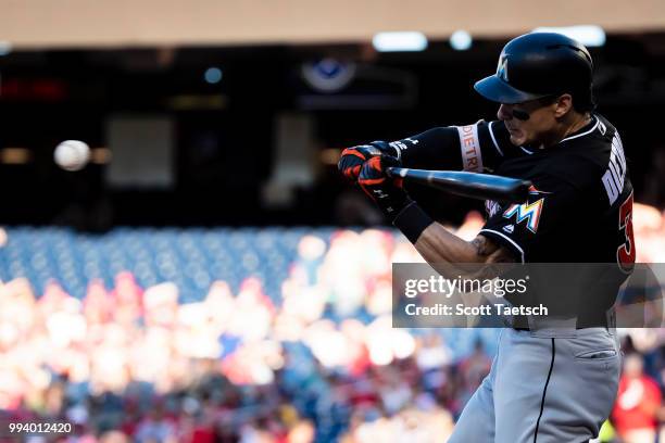 Derek Dietrich of the Miami Marlins at bat during the first inning against the Washington Nationals at Nationals Park on July 07, 2018 in Washington,...