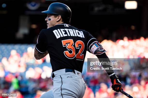 Derek Dietrich of the Miami Marlins singles during the first inning against the Washington Nationals at Nationals Park on July 07, 2018 in...