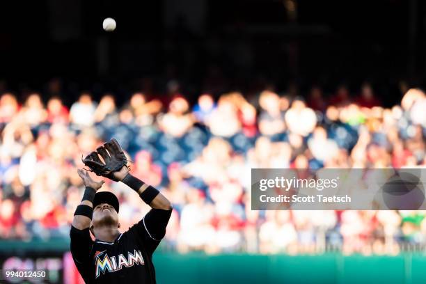 Starlin Castro of the Miami Marlins catches a fly ball hit by Trea Turner of the Washington Nationals during the first inning at Nationals Park on...