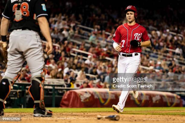 Trea Turner of the Washington Nationals scores against the Miami Marlins during the seventh inning at Nationals Park on July 07, 2018 in Washington,...