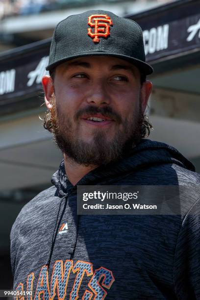 Ray Black of the San Francisco Giants stands in the dugout before the game against the St. Louis Cardinals at AT&T Park on July 8, 2018 in San...