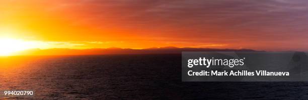 sun sets in akaroa - akaroa stock pictures, royalty-free photos & images